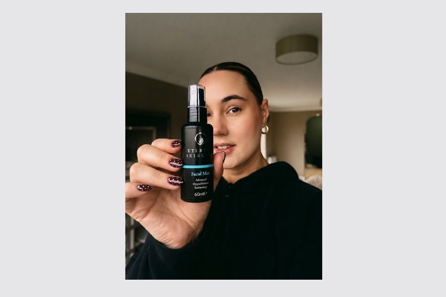 Grace holding Eternal Skincare Advanced Hypochlorous Facial Mist as she shares her personal skin story